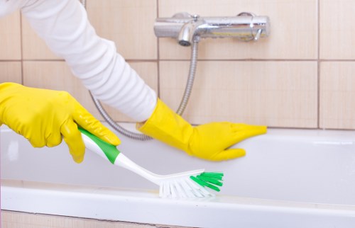 Cleaner wearing PPE while preparing carpet cleaning tools